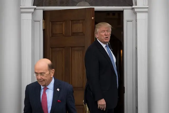 Trump says goodbye to investor Wilbur Ross following their meeting at Trump International Golf Club in Bedminster Township, New Jersey over the weekend.